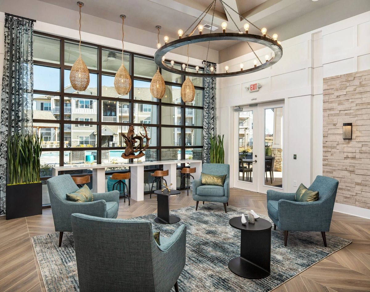 Clubhouse lounge and pool at a Bobo-managed Florence community