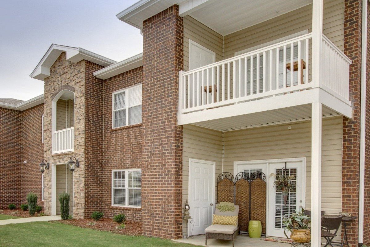 Seville Place apartment building exterior with trees, Florence Alabama